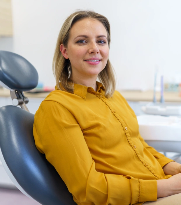 Woman sitting in a dental chair