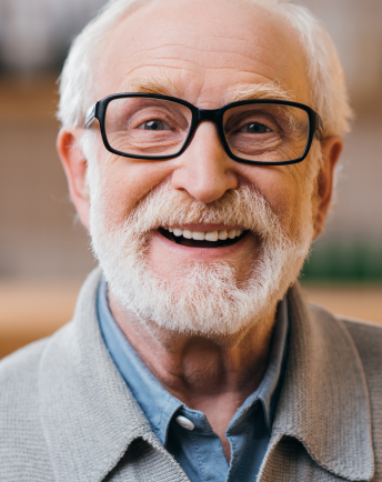 Elderly man smiling at the camera